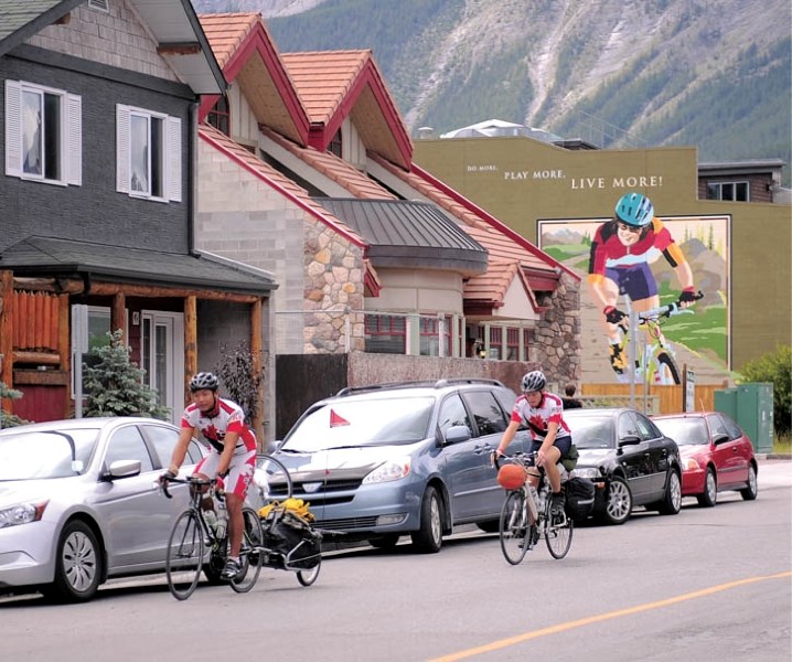 Dennis Choi (left) and Sean House are cycling across Canada to promote bike safety and raise funds for Right To Play. The pair passed through Canmore on July 21.