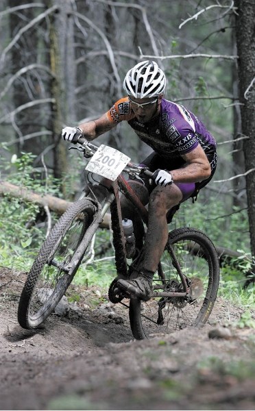 A muddy Cory Wallace leads the field through the mud in the early stages of the 24 Hours of Adrenalin Saturday (July 23).