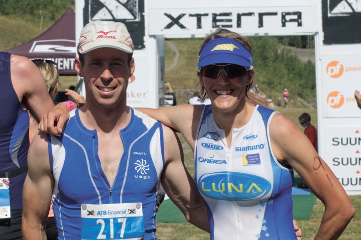 Mike Vine and Danelle Kabush celebrate their victories in the Xterra off-road triathlon on Sunday (Aug. 14).