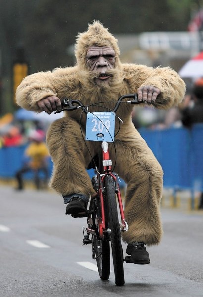 Bigfoot pedals down Banff Avenue as he takes part in the BikeFest cruiser crit.