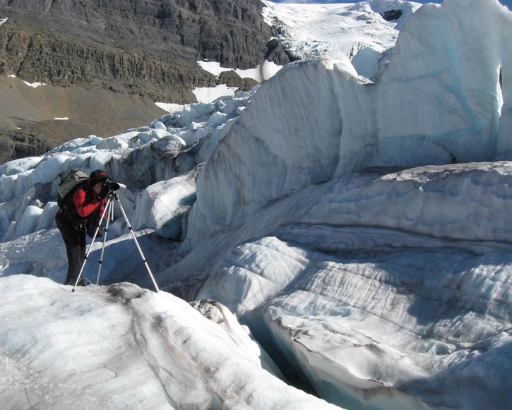 Artist Jan Kabatoff trains her lens on the fascinating features of an icefall on the Athabasca Glacier to capture images for her ongoing exhibit on glaciers.