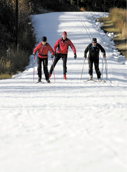 Judy Buchanan-Mappin, Dave Rees and Mike Mappin enjoy getting back on skis as they take to the Canmore Nordic Centre’s Frozen Thunder ski loop Saturday (Oct. 15). The trail