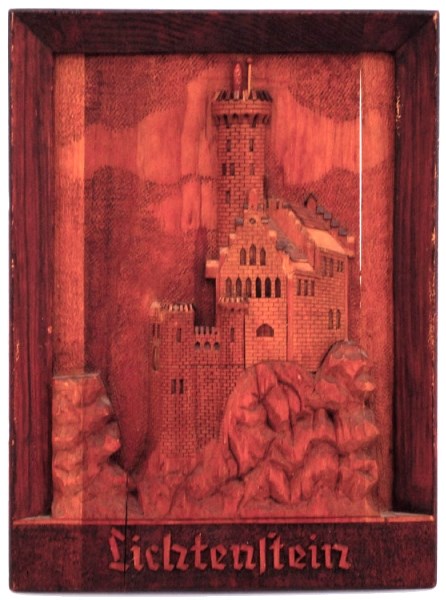 A wooden wallhanging carved at the Ozada prisoner of war camp by a German PoW during the Second World War.