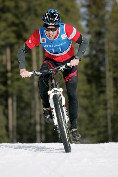 Mike Vine enjoys hard-packed snow during the bike leg as he races to victory in Saturday’s (March 31) Canmore Winter Meltdown Triathlon at the Canmore Nordic Centre. The