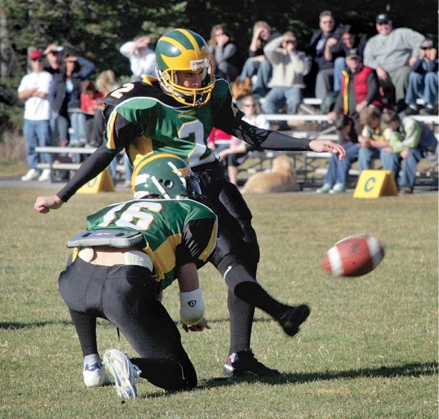 Austin Anderson attempts a field goal while playing for the Bow Valley Wolverines high school football team in 2006.