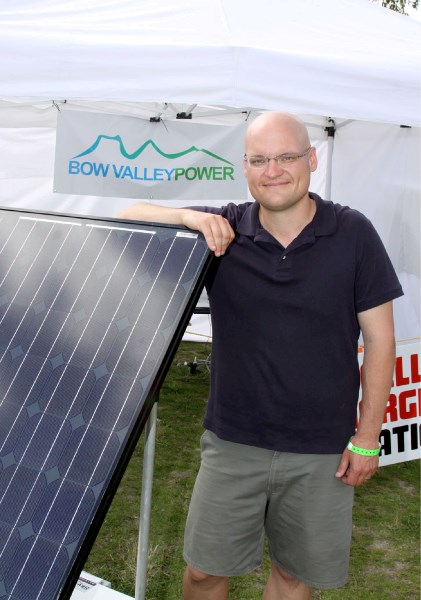 Charlie Bredo of Bow Valley Power with a solar panel used to charge cellphones during the Canmore Folk Festival (Aug. 3-5). Solar panels are one green power option.