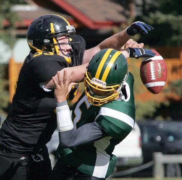 Bow Valley Wolverines quarterback Wes Rose is smothered by the Olds Spartans defense during Saturday’s (Oct. 6) 23-6 loss at Millennium Field.