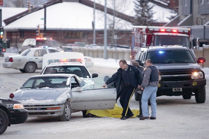 Police examine the scene of a Jan. 10, 2011 shooting at Railway Avenue and Gateway Street.