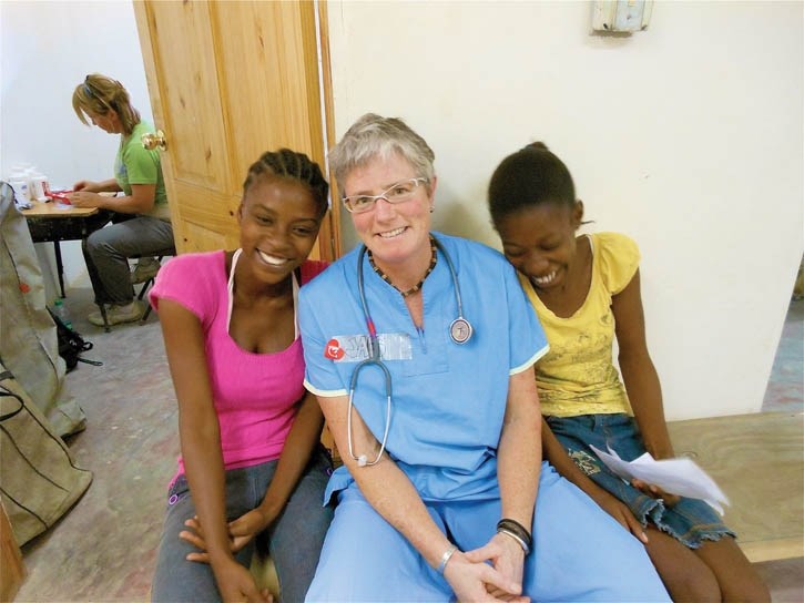 Jacqueline Hutchison with a pair of local Haitian girls, during her recent medical mission.