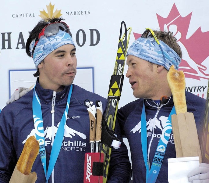 Jesse Cockney (L) and Brent McMurtry celebrate on the podium after winning the team sprint.