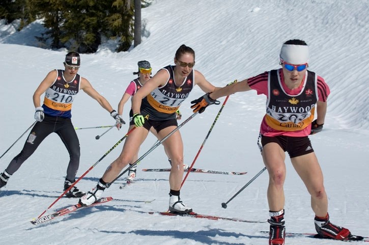 Biathlete Zina Kocher (centre) beat the country’s top cross-country skiers for the national title in the 30-km.