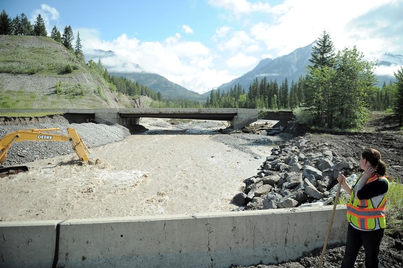Crews work on the westbound lanes of the Trans-Canada Highway at Carrot Creek between Banff and Canmore.