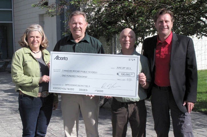 Alison Brewster, left, and Rick Werner of ID 9 with Kim Bater and Chris MacPhee at a cheque presentation for the future Kascades Centre.
