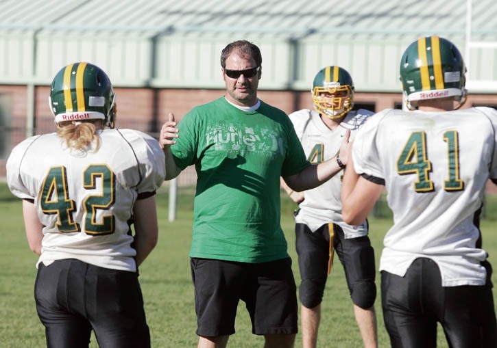 Wolverines head coach Chad McClenaghan explains fundamentals to his players at Tuesday evening’s (Sept. 10) practice.
