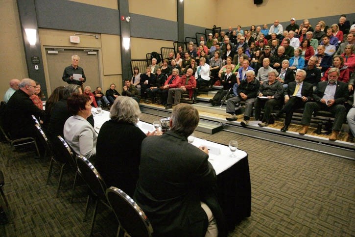 Canmore council candidates address a packed house at Solara Resort Tuesday night (Oct. 8).