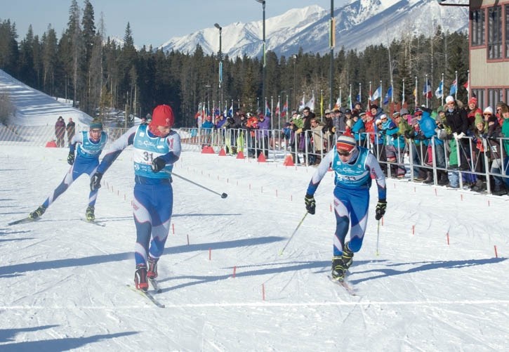 Riley Millar, left, leads the Canmore Nordic sweep in the juvenile boys sprint.