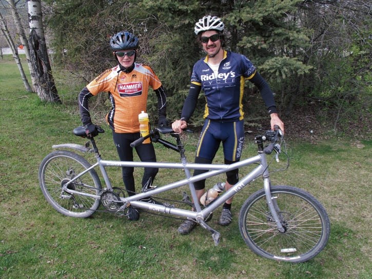 Alex Weber and Jonathon Nutbrown with the tandem bike they used to cycle from Vancouver to Calgary.