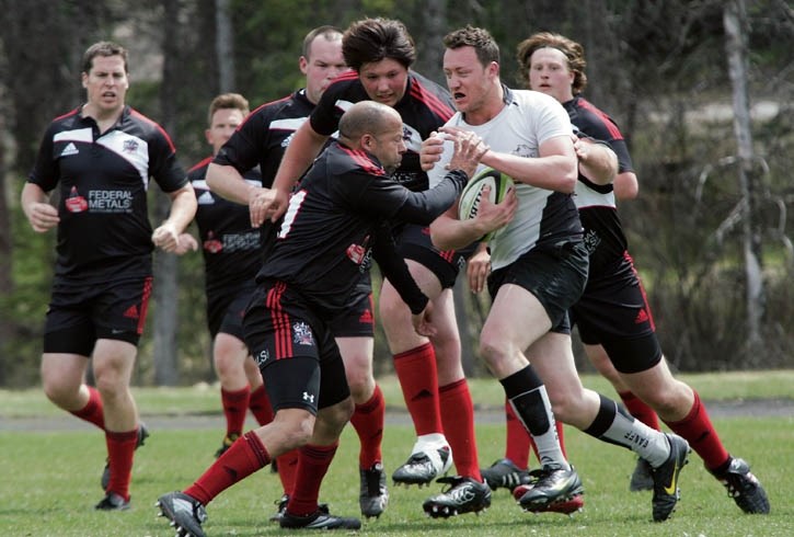 Banff’s Lucas Dybik plows through the Knights defence for a try at the Banff Rec Grounds Saturday (May 24).
