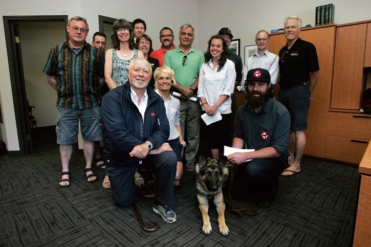 MLA Ron Casey poses with Bow Valley community groups at Thursday’s (July 3) funding announcement.