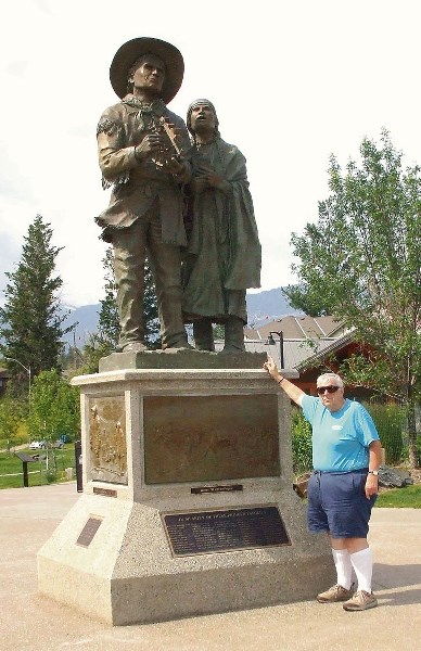 Pat McDonald points to Charolette Small at the statue of Small and her husband, explorer and furtrader David Thompson, located at Windemere near Kootenai House.