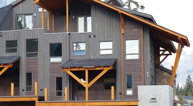 In the gorgeous, lush mountain environment of Canmore, AB, the exterior fir timber frame at Versant at Stewart Creek is completed.