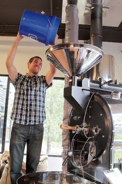 Rave Coffee’s Dean Smolicz feeds a roaster made in Turkey with 15 kg of beans. The roastery is located in the former Railway Deli location.