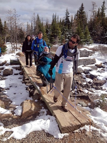 Rocky Mountain Adaptive Sport Centre volunteers help a participant gain access to Larch Valley on Friday (Oct. 3).