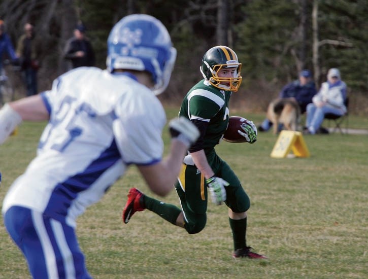Jackson Howatt runs the ball during the Bow Valley Wolverines commanding 26-0 playoff victory over the Highwood Mustangs at Millennium Park in Canmore Saturday (Oct. 25).