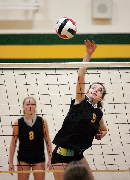 Banff’s Rosie Macdonald makes a shot during junior varsity volleyball action at Canmore Collegiate High School Saturday (Oct. 25).