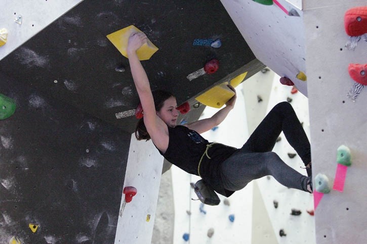 Manon Mackasey negotiates an overhang as she climbs to victory in the Tour de Bloc bouldering competition at Elevation Place Saturday (Jan. 10).
