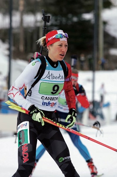 Zina Kocher skis into the range during IBU race action at the Canmore Nordic Centre.