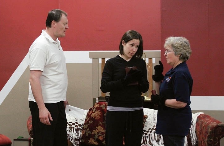Mortimer (Jason Wilkinson) discusses the Brewster family situation with aunts Abby (Erin Walsh, centre) and Martha (Francoise Campbell) during a rehearsal of Arsenic and Old
