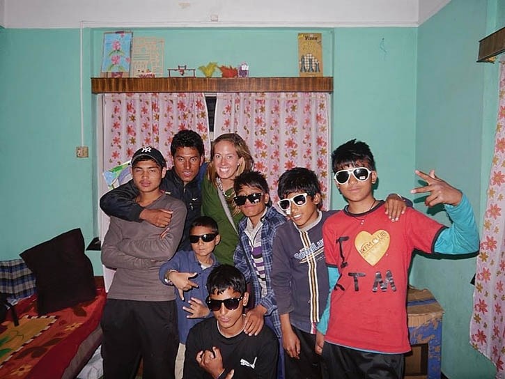 Lauren Taylor, centre, with a group of Nepalese youth she volunteers with.