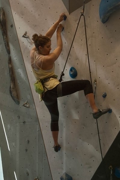 Above: Alison Vest powers her way up a route at Elevation Place Sunday (April 19).