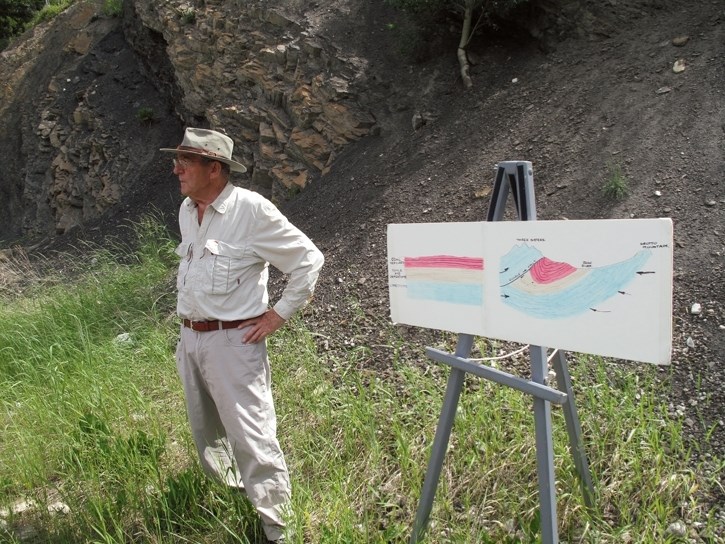 Gerry Stephenson on Three Sisters Drive in front of an exposed coal seam during one of his tours.