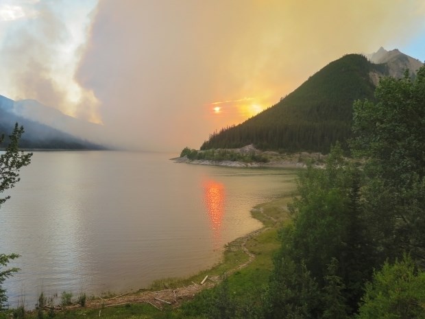 A smoky sunset last Friday in Jasper National Park as a 5,000-hectare fire burns in the Maligne Valley area.