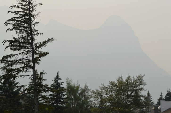 A smoke-filled sky adds colour to Vermilion Lakes and Mount Rundle as smoke from fires in Washington dominate the Bow Valley skyline, Monday morning (Aug. 24).