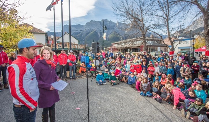 Biathlete Scott Perras and Sara Renner greet an enthusiastic crowd of Canmore school children during the event celebrating 100 day countdown until the world cups.