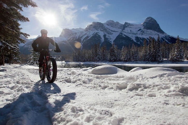Ryan Draper rides his fat bike along the Bow River in Canmore.