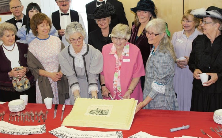 Louise Mattson, 92, cuts the cake celebrating the 125th anniversary of the Ralph Connor Memorial United Church.