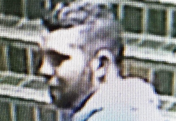 A surveillance footage image of a suspect wanted in connection to an assault in Banff Wednesday morning (March 2).