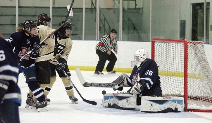 Rose Noonan and Maria Golbs battle in front of the net against Shaftesbury Friday evening (Feb. 26).
