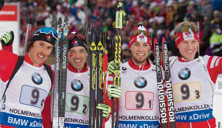 (L to R) Brendan Green, Nathan Smith, Christian Gow and Scott Gow celebrate their bronze medal at the world biathlon championships in Norway.
