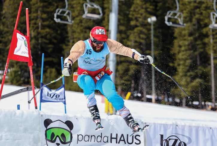 Adam Kennedy, dressed as Simpsons character Duff Man, takes a jump at the 11th annual Rob Bosinger Memorial Cup at Mount Norquay Ski Resort near Banff, Saturday (April 16).