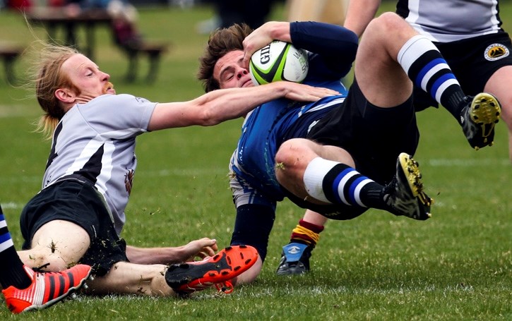 Andrew Phillpot makes a tackle against the Calgary Rams at Millennium Park in Canmore on Saturday (April 23).