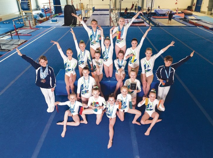 The Canmore Illusions gymnastics team poses at the Canmore Recreation Centre on Wednesday (April 27) with medals won at the Alberta Gymnastics Provincial Championships.