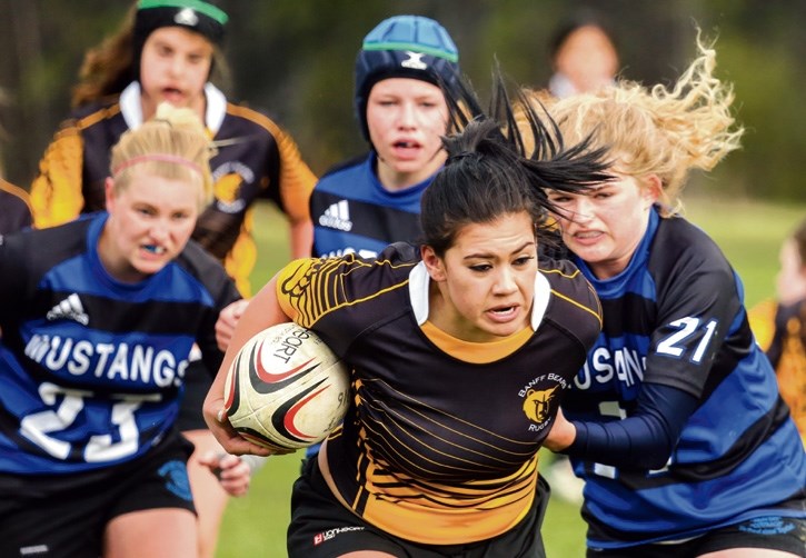 BCHS Bear Tasha Wespi powers through the Highwood Mustangs at the Banff Recreation Grounds in Banff on Thursday (May 12).