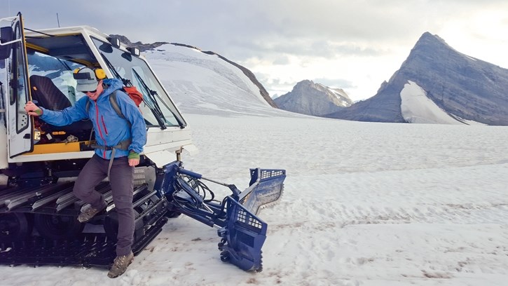 Darren Farley steps onto the Haig Glacier to begin his nightly grooming duties.