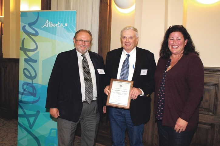 MD of Bighorn councillor Erik Butters, middle, accepts the 2016 Municipal Heritage Preservation Award on behalf of the MD during the Alberta Historical Resources Foundation
