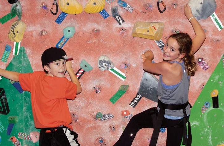 Grade 4 student Finn McKenna and Grade 5 student Breanne Carr enjoy an afternoon at Banff Centre’s Sally Borden Recreational Centre’s indoor rock climbing wall.
